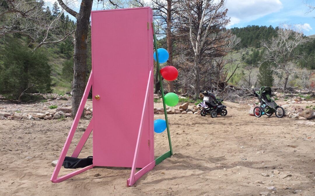 a pink doorframe in the desert