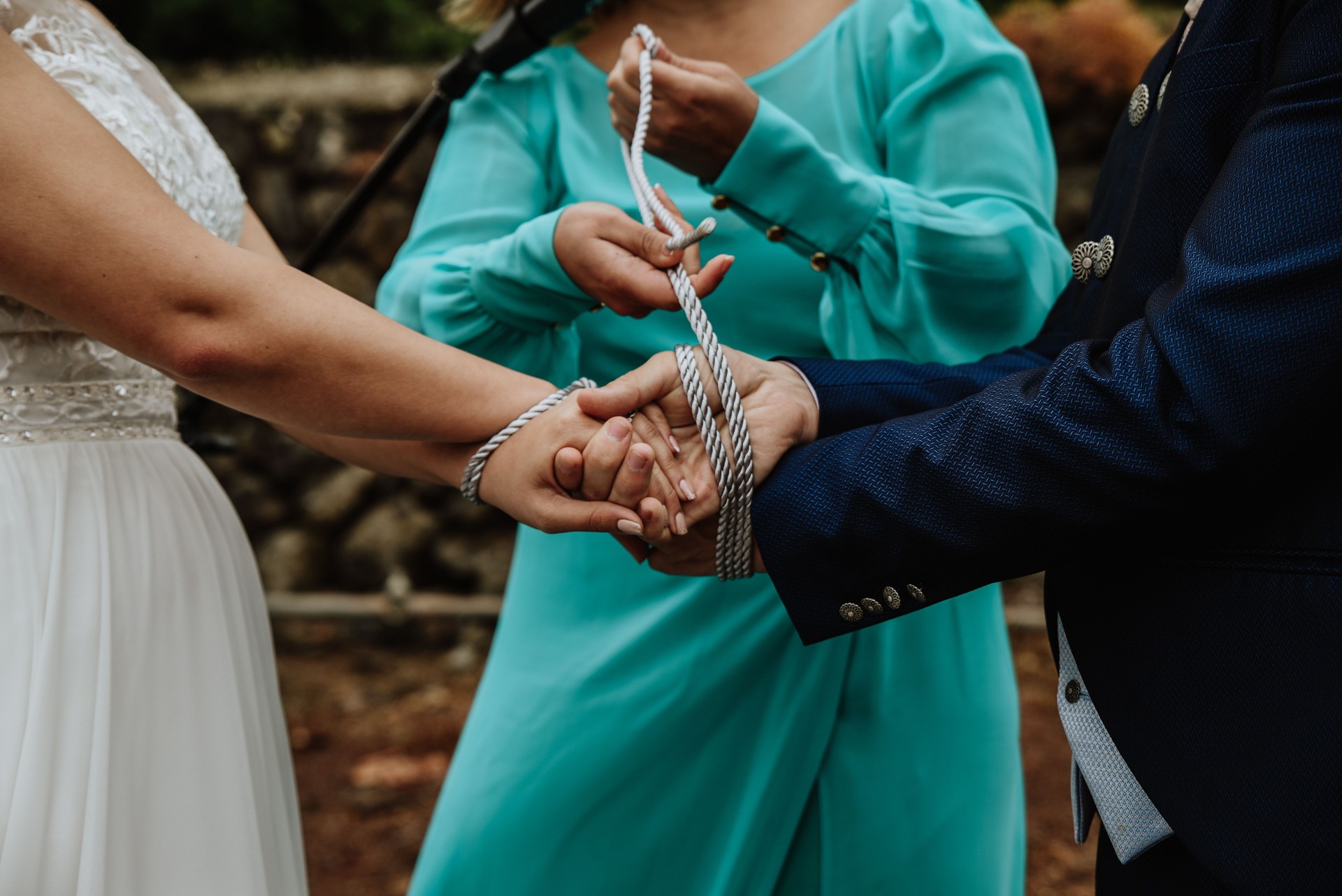 Traditional handfastening ceremony during the wedding